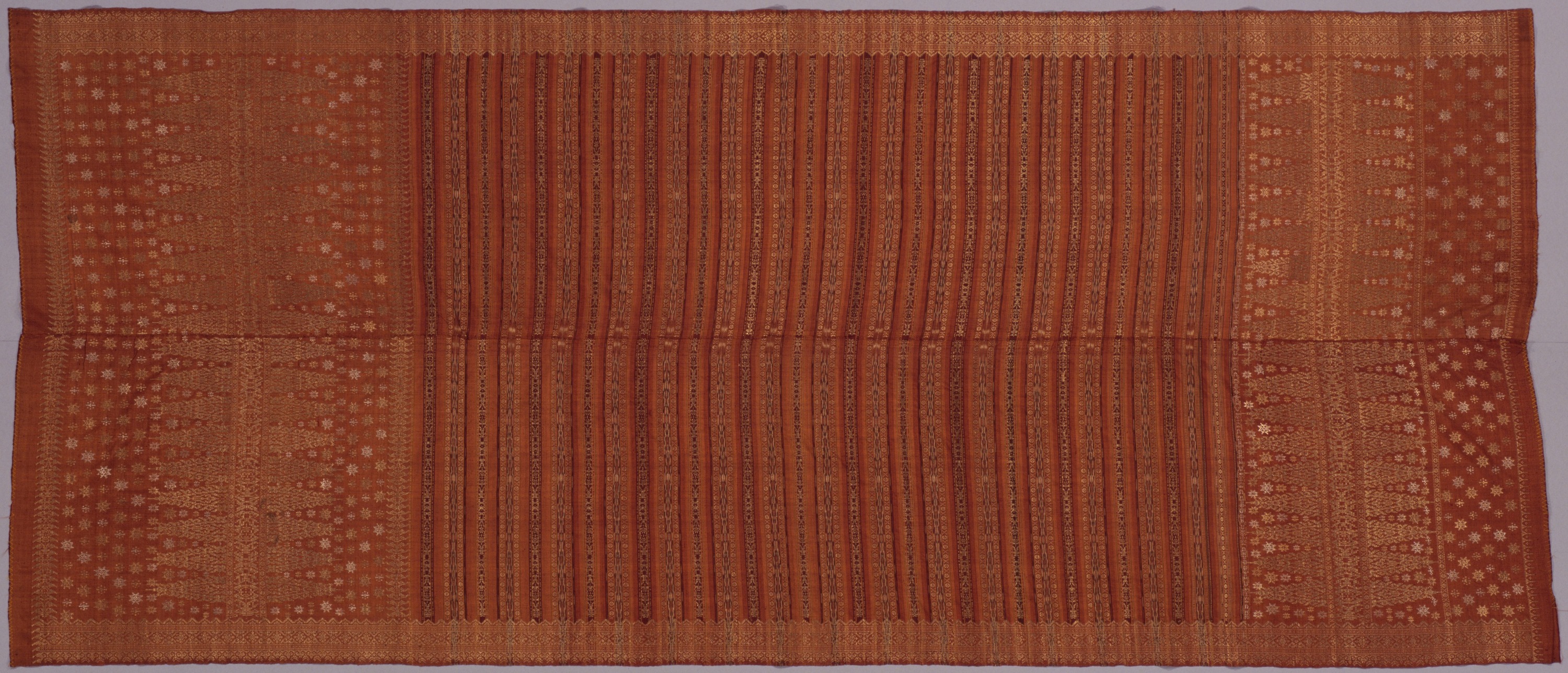 赤茶地縞絣金糸紋織祭礼布　1枚